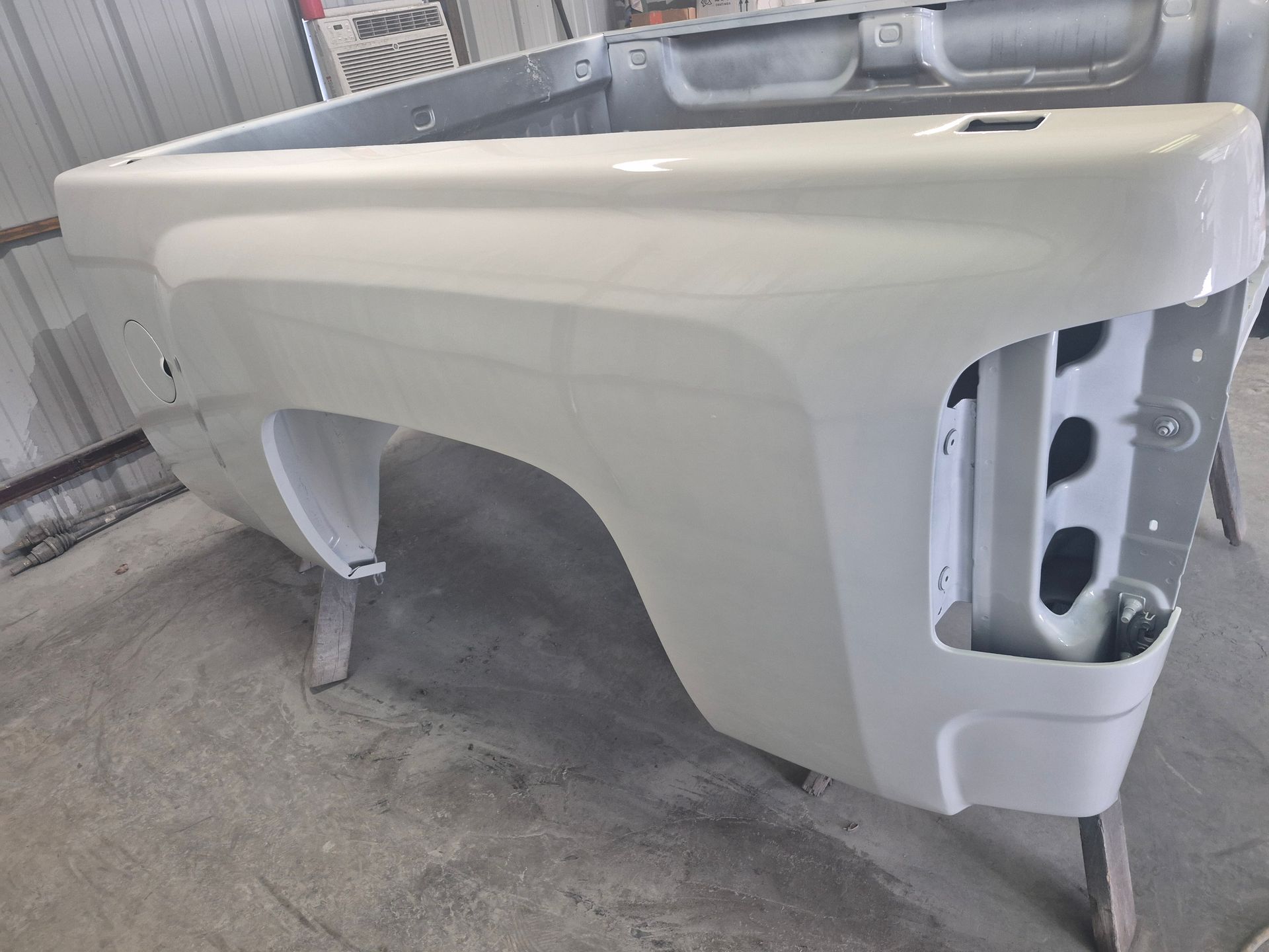 Painted auto body part after repair work