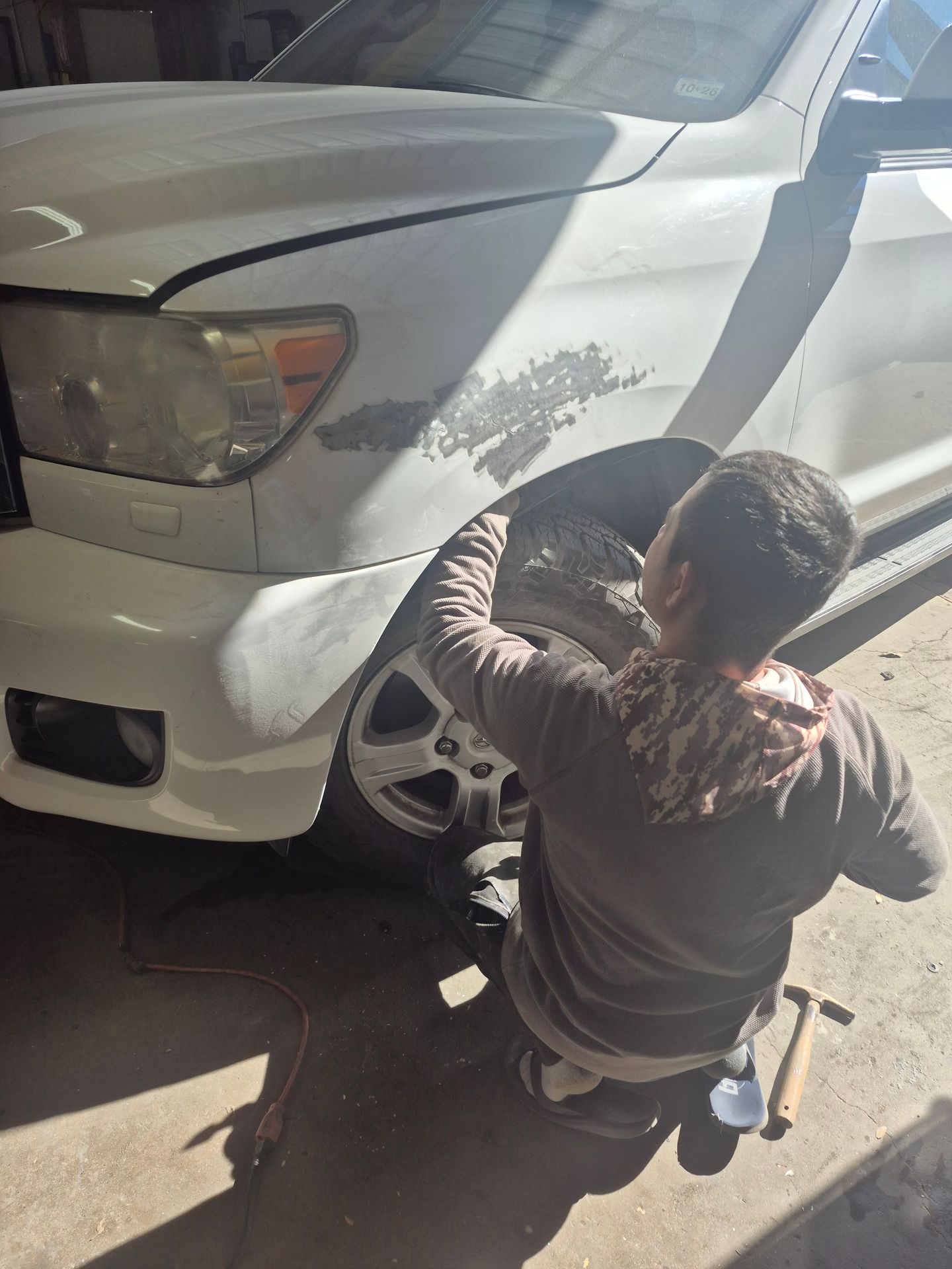 Technician working on a vehicle repair